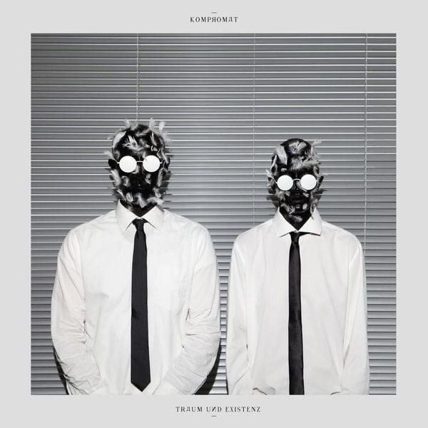 The album's cover representing 2 bald men in white shirts, black ties, the face smeared with tar and feathers. They're standing up, still, face to the photographer and in front of a metal curtain.