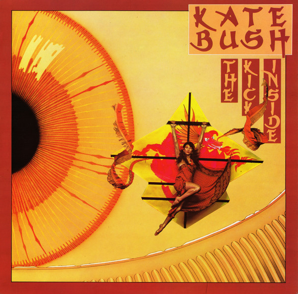 The left part is a huge red and yellow eye. At the center, Kate Bush in a red dress is hanging from a yellow kite with a red Asian dragon design.