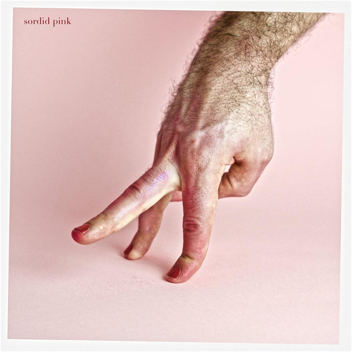 Pink background, one hairy hand with index and ring finger touching the surface, and the middle finger getting up.