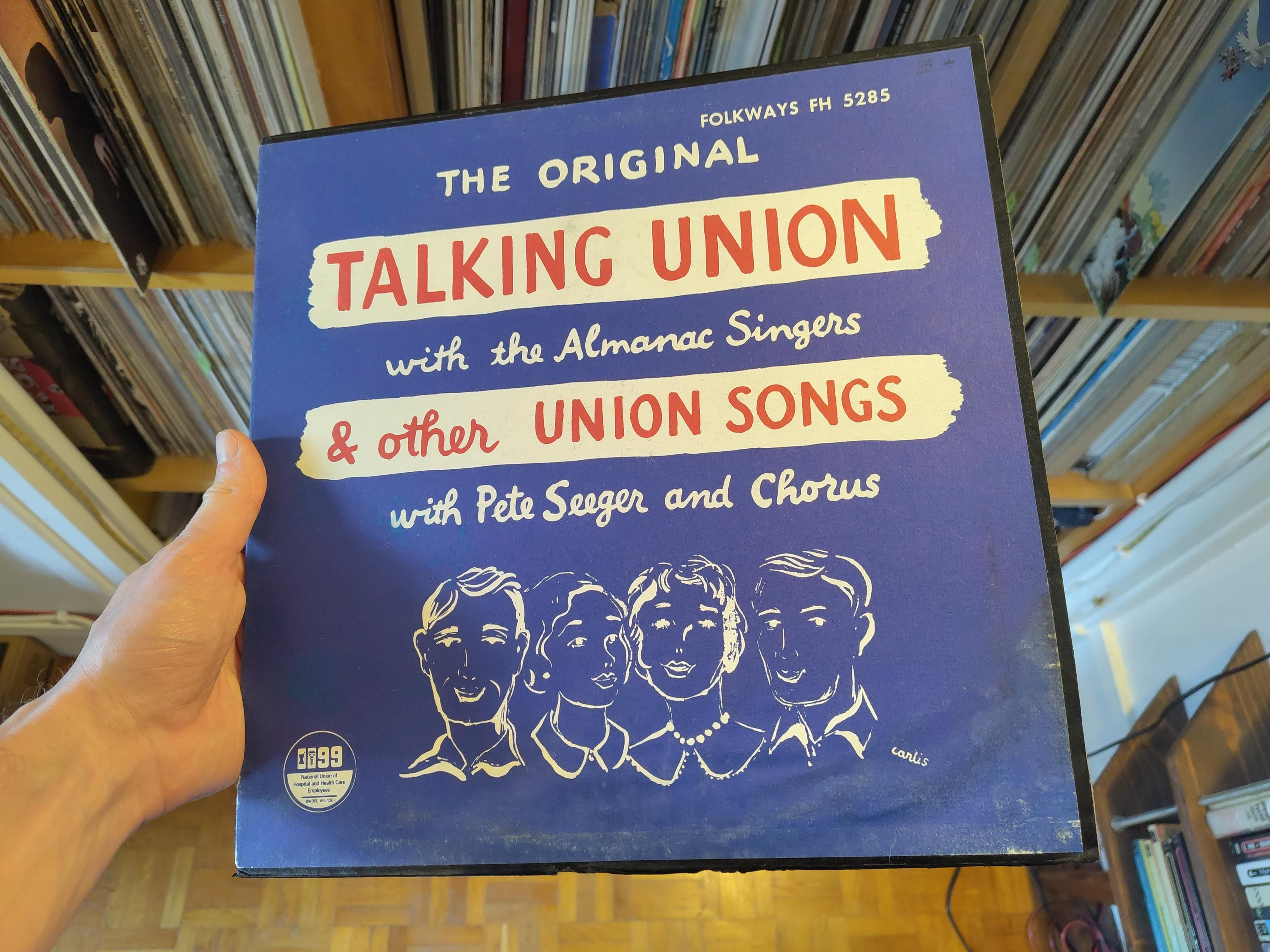 Pochette intégralement bleu profond, avec un fin liseré noir sur le pourtour. Le titre est écrit en blanc sur ce fond bleu, en écriture cursive, à l'exception de « Talking Union » et de « & Other Union Songs », en capitales d'imprimerie rouges sur fond de cartouches blancs. En bas, les bustes dessinés de deux hommes et deux femmes, en bkanc sur fond bleu.